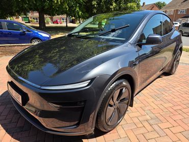 Front 3/4 of Tesla Model Y polished to gloss by AM Auto Aesthetics