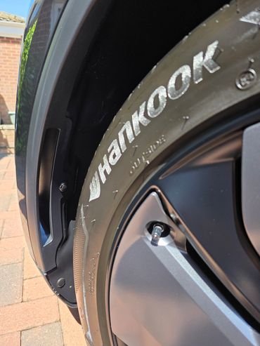Close up of front wheel arch showing tyre gloss and clean arches