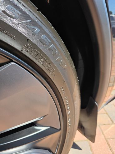 Close up of rear wheel arch showing tyre gloss and clean arches