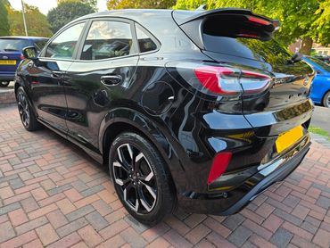 Rear 3/4 of Ford Puma showing paintwork symmetry after detail