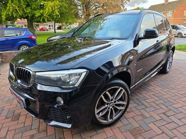 Front 3/4 of blue BMW X3 polished to gloss by AM Auto Aesthetics