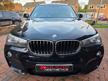 Front of blue BMW X3 showing gloss after polish by AM Auto Aesthetics