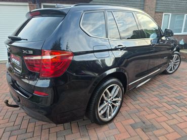 Rear 3/4 of blue BMW X3 polished and detailed by AM Auto Aesthetics