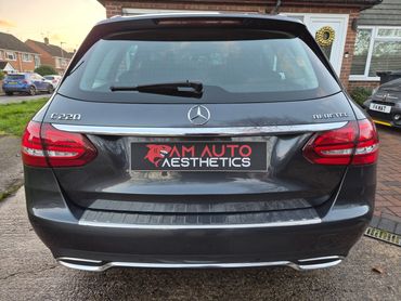 Rear view of a Mercedes-Benz C220 BlueTEC with AM Auto Aesthetics branding.