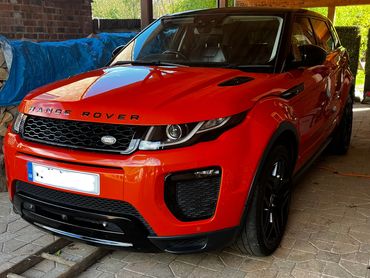 Front 3/4 of orange Range Rover Evoque polished to gloss by AM Auto Aesthetics