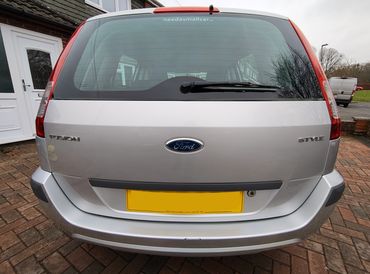Rear of silver Ford Fusion with boot gloss and clean exhaust finish