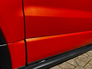 Orange Range Rover Evoque Exterior close up rear passenger door