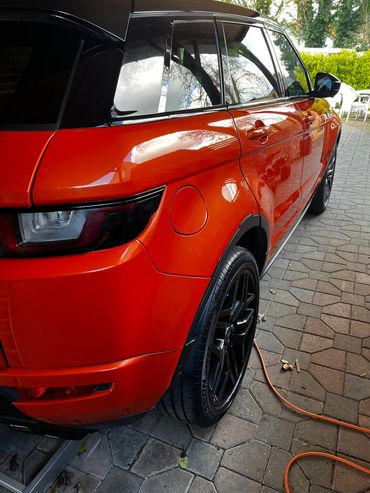 Rear 3/4 of orange Range Rover Evoque polished and detailed by AM Auto Aesthetics
