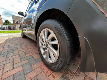 Rear 3/4 of grey Hyundai Tuscon showing paintwork symmetry after detail