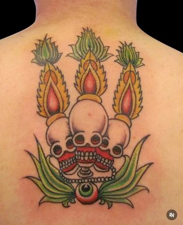 Bold Tibetan skull and flame tattoo—custom spiritual back piece by Stoic Body Art in Columbus, Ohio