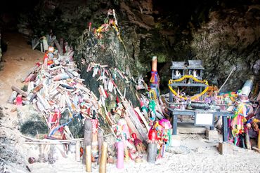Wooden penis offerings are left inside Phra Nang Cave.