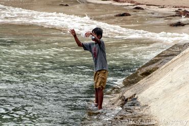 A boy fishes in Sabang 