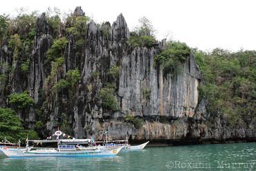 Limestone cliffs and boats in Puerto Princesa 