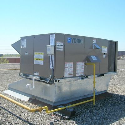 Rooftop RTU HVAC unit sitting on a curb adapter