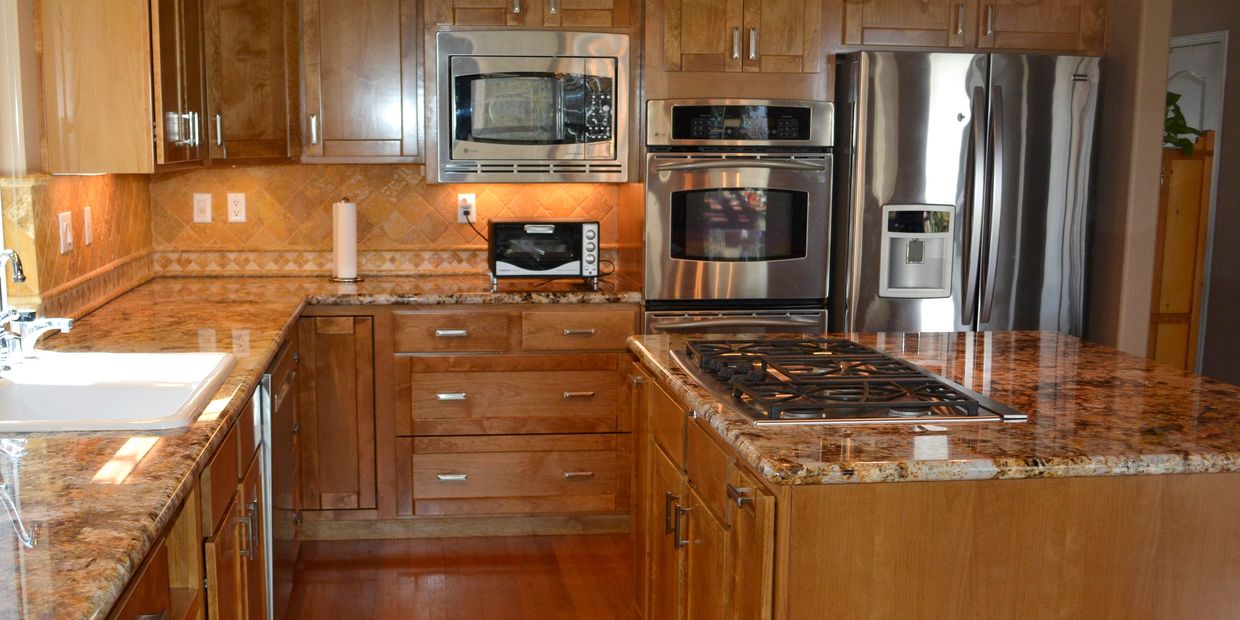 Kitchen Displaying Cabinet Refacing by Pat's Custom  Cabinetry