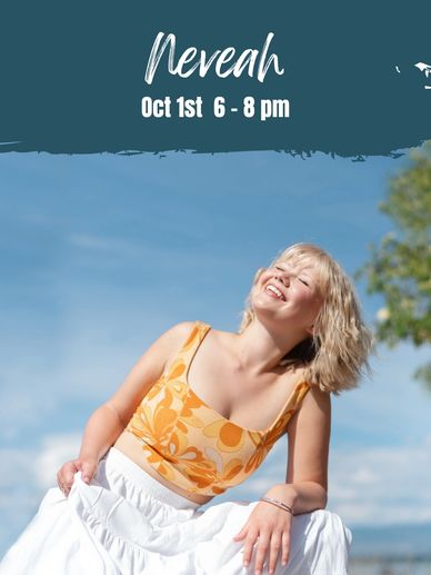 Smiling woman in yellow top enjoying sunshine outdoors.