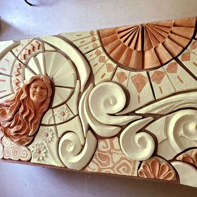 Portrayed is the clay mural completed and awaiting the bisque firing.