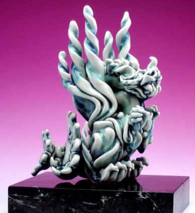 A ceramic porcelain dragon art sculpture