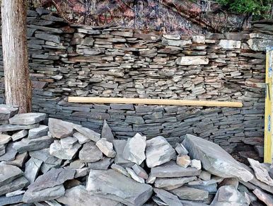 Reconstructing the stone wall in preparation  for installation