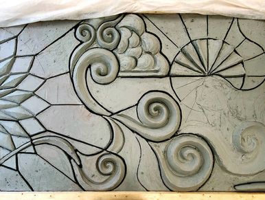 The process of sculpting the mural in this image