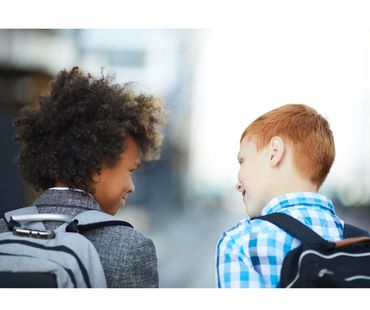 Emergency childcare service picking child up from school.