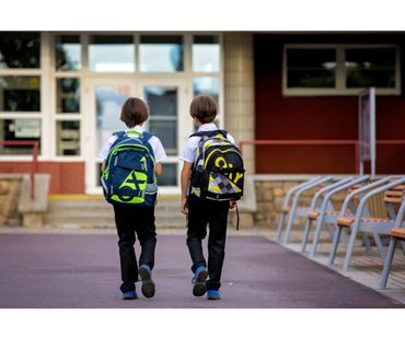 Emergency childcare worker dropping children of to school.