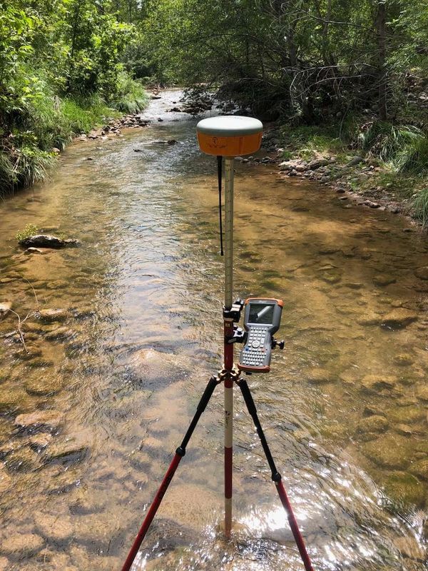 Survey tools standing in water