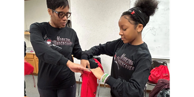Two women doing some activity at an event