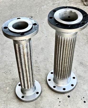 Two stainless steel braided flexible metal hoses with flanges on both ends.