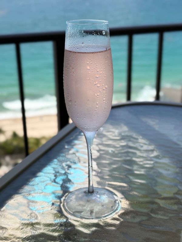 Champagne glass on table  with condensation.