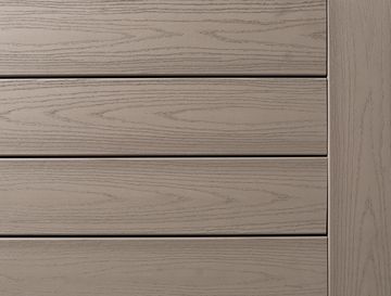 Light brown wooden paneling with horizontal and vertical planks.