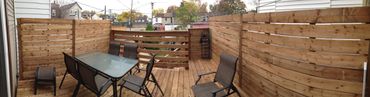 Pressure treated deck with wooden privacy fence/ railing. Patio set and chairs. Located in Durham Re