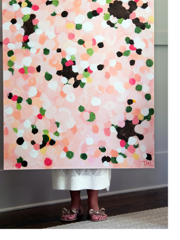 artist holding her abstarct art