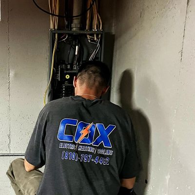 Cox electrician completing residential electrical work in Rochester, Michigan