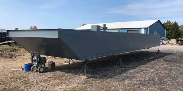 Barge sitting on gravel