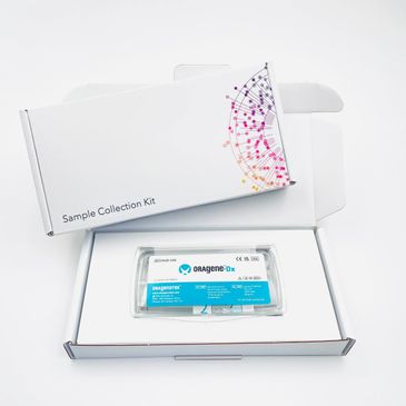 Oragene Dx DNA sample collection kit in an open white box.