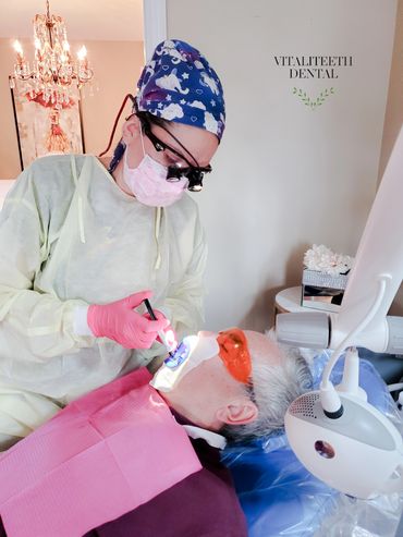 Mobile dental hygienist Monica Cordova guarding the gums during Philips Zoom teeth whitening