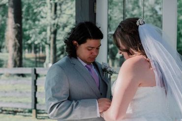 Groom and bride exchanging rings