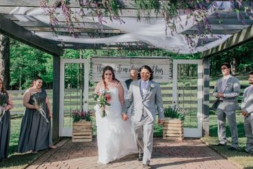 Bride and Groom walk down aisle after their marriage