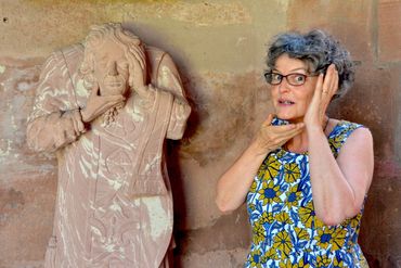 Judith König explains headless St. Alban in The Cloisters, St. Martin's Cathedral, Mainz, Germany