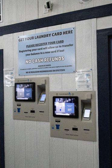 Laundry value add machines with registration instructions and no cash refund policy.