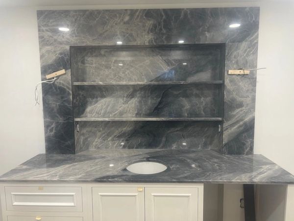 Lined Quartzite Bar with Shelves and Custom Full Height Backsplash