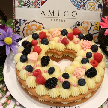 Decorative fruit and cream ring cake from Amico Bakery.