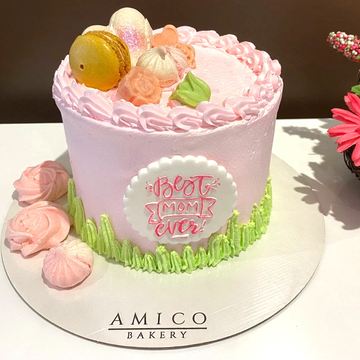 Pink cake decorated for Mother's Day with "Best Mom Ever".
