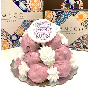 Pink dessert with white cream and "Best Mom Ever" decoration.