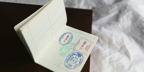 Close-up of a passport page with multiple entry stamps.