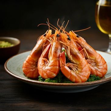 A plate of cooked shrimp arranged on a bed of green garnish.