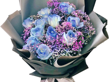 A bouquet of blue roses with purple and white baby's breath flowers wrapped in black paper.