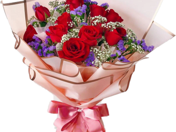 Elegant bouquet of red roses with purple and white filler flowers wrapped in pink paper.