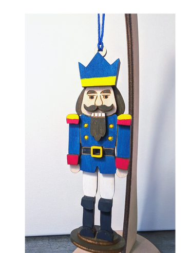 Miniature Nutcracker Wood ornament in bright colors.
